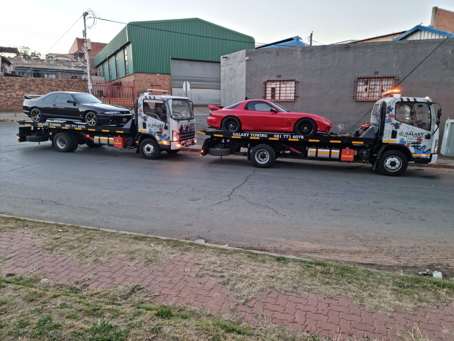 Galaxy Towing rollback recovering a Land Rover Defender on the highway